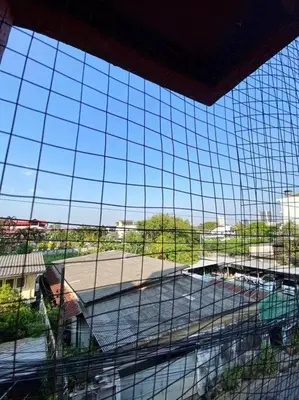 a view through a glass window of a train station at Ratanawong Place 206 in Bangkok