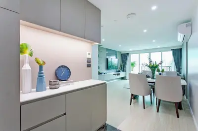 a kitchen and dining room with a table and chairs at GM Residence in Bangkok
