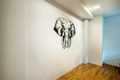 a drawing of an elephant on a wall at Phra Nakhon Poshtel in Bangkok