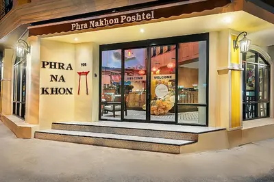 a store front of a pizza naja khalili at Phra Nakhon Poshtel in Bangkok