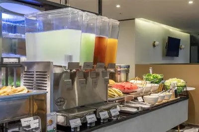 a kitchen with some food on a counter at Best Western Ratchada Hotel in Bangkok