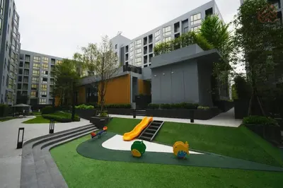 a playground in front of a building with a slide at NEST Sukhumvit71 BTS - Pool, Fitness, Parking, Wifi in Bangkok