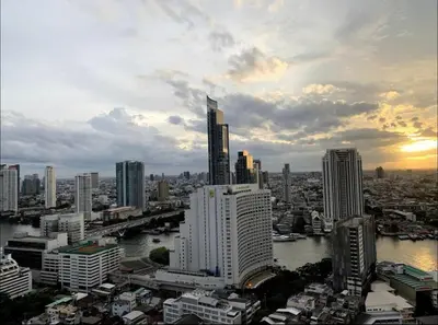 a view of a city with a river and buildings at Central Bangkok, 5 stars river view & characteristic decor in Bangkok
