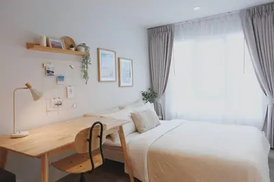a bedroom with a bed and a desk and a bed at Minimal Cozy Room near Chatuchak Weekend Market #1 in Bangkok
