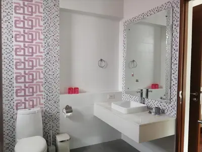 a white bathroom with a sink and a mirror at AP HOUSE in Bangkok