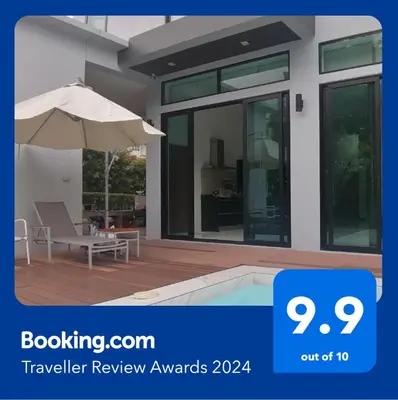 a review of a house with a patio and an umbrella at AP HOUSE in Bangkok