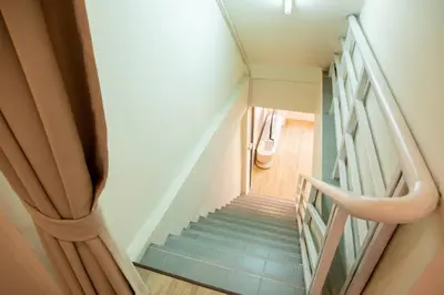 a view of a staircase in a house at 2BR minimal mu-ji style 130SQM ~ in Makkasan