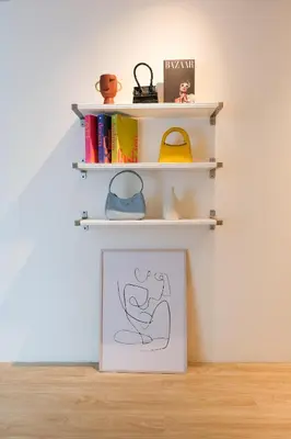 a drawing on a white wall with shelves at 2BR minimal mu-ji style 130SQM ~ in Makkasan