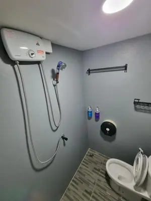 a bathroom with a shower and a toilet in a room at Met A Space Pod @Phrom Phong in Bangkok