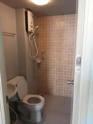 a small bathroom with a toilet and a shower at T8impact Challenger Mueang Thon Thani Free WIFI in Nonthaburi