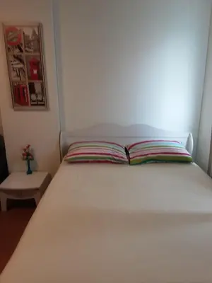 a bed with an open book on it in a room at T8impact Challenger Mueang Thon Thani Free WIFI in Nonthaburi