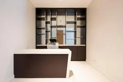 a room with a table with a vase on it at M Estate 2BR Private Residence, 300m to BTS Chit Lom in Bangkok