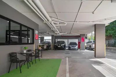 a parking garage with cars parked in it at iCheck inn Darisa Ngamwongwan in Nonthaburi