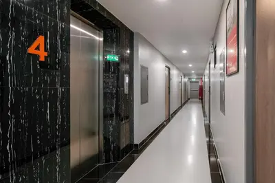 a hallway with a sign on the wall at iCheck inn Darisa Ngamwongwan in Nonthaburi