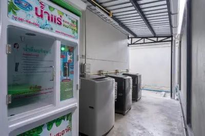 a gas station with a row of machines at iCheck inn Darisa Ngamwongwan in Nonthaburi