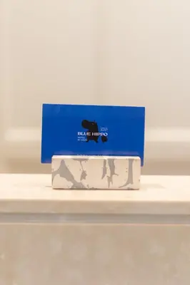 a box on top of a table with a blue box at Blue Hippo & Red Crocodile Hotel in Bangna